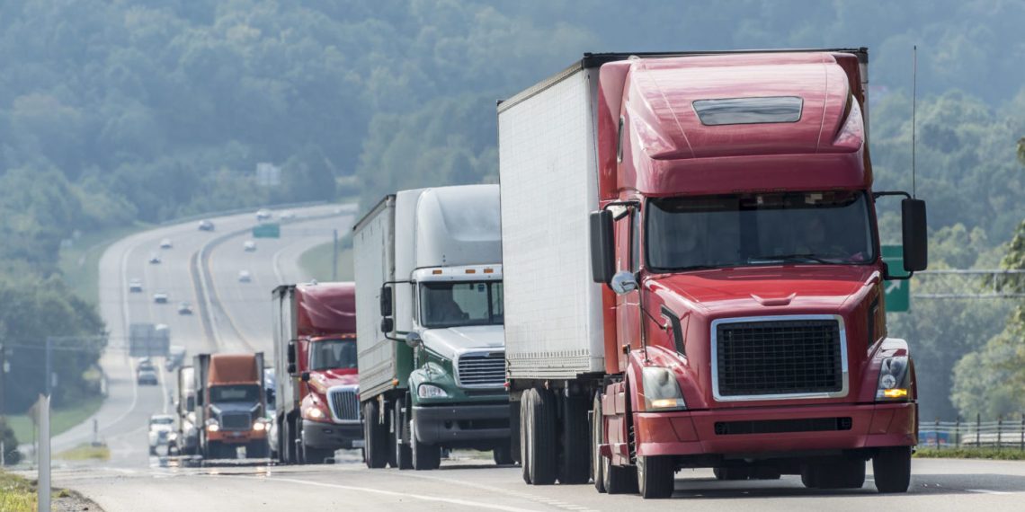 32567551 - big truck convoy traveling on highway