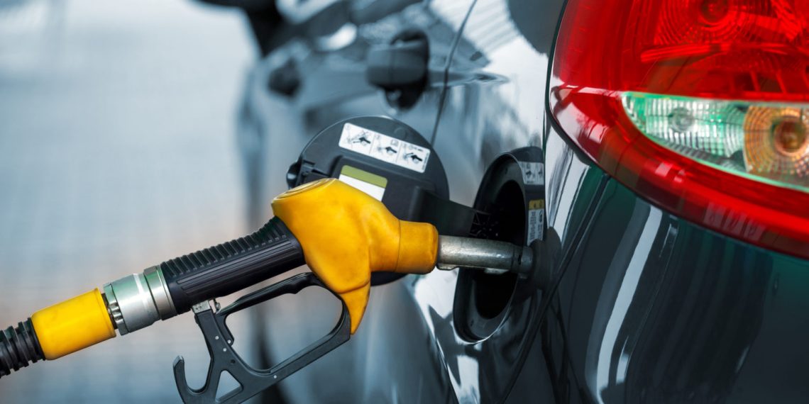 Car refueling on a petrol station closeup